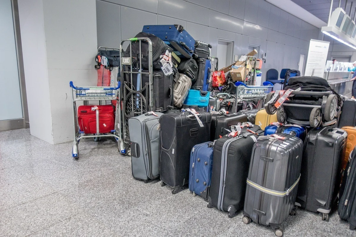 Large pile of delayed baggage at the airport