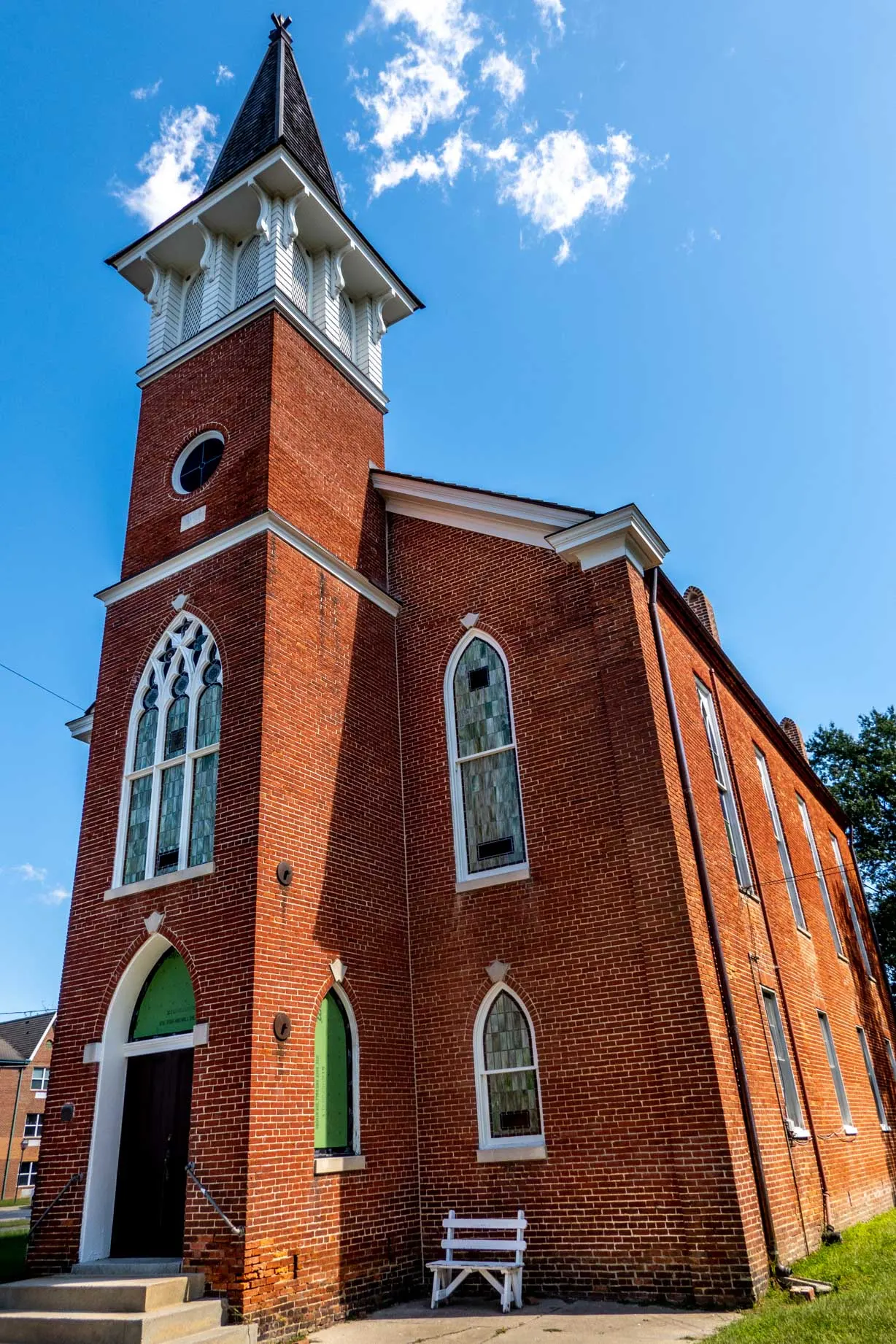 Red brick church with stained glass windows