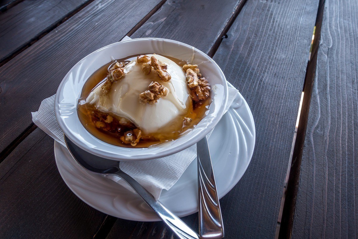 Yogurt with honey and walnuts in a bowl