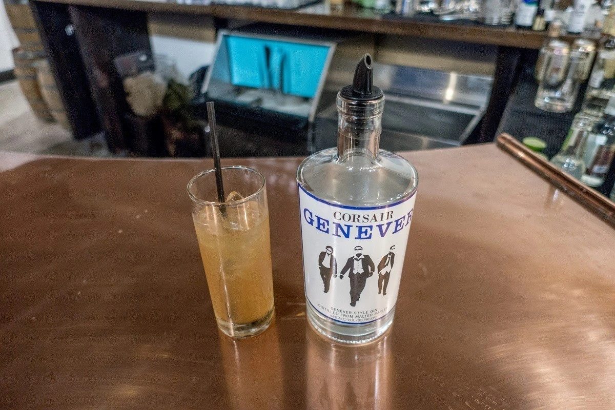 Genever bottle and cocktail on a counter at Corsair Distillery in Nashville