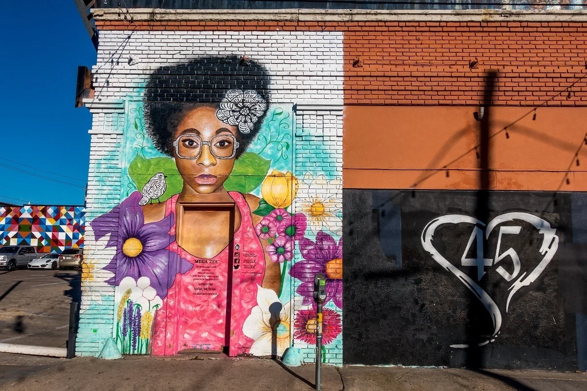 Street art mural of a woman with flowers