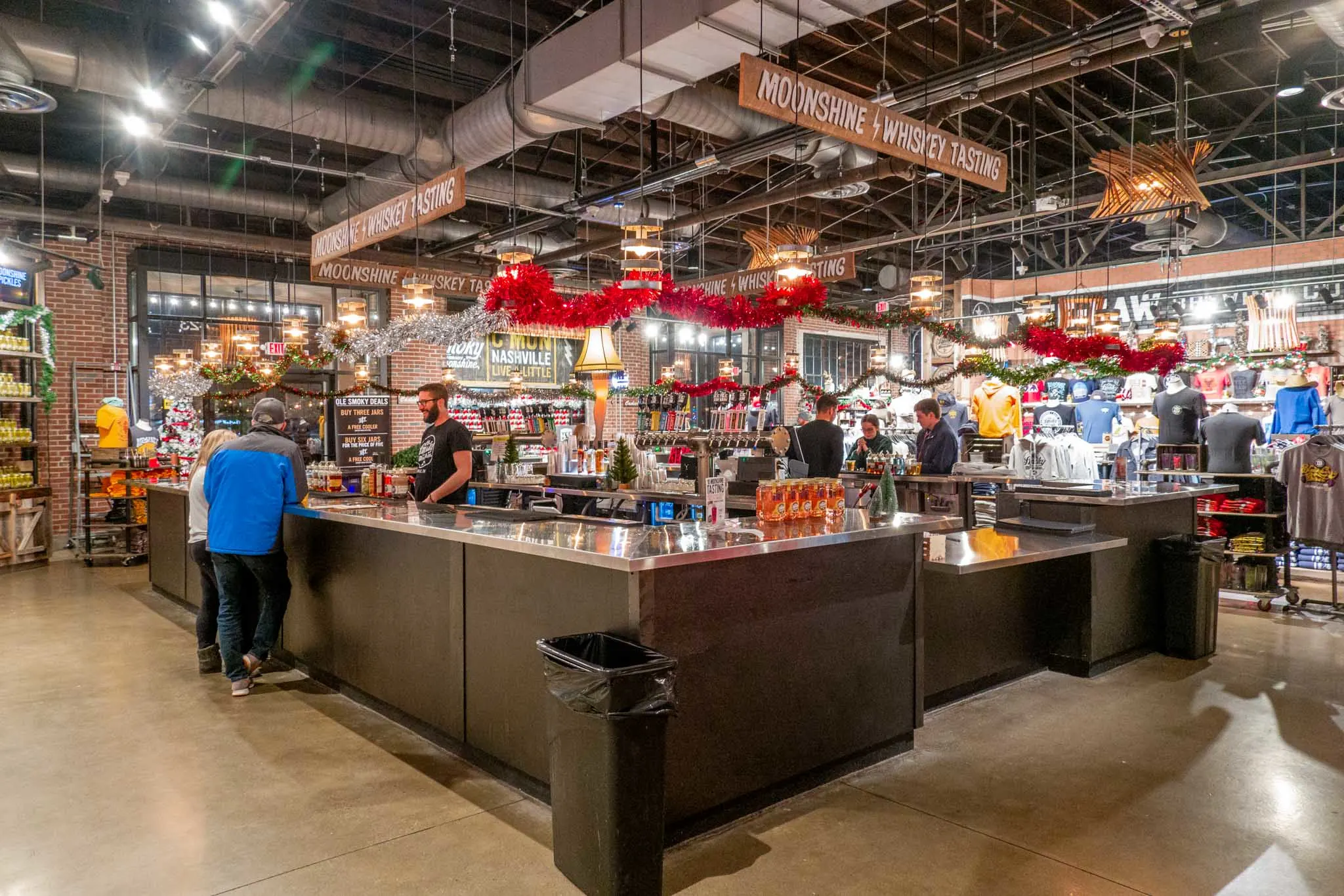 Large moonshine tasting bar in a large room at Ole Smoky Distillery