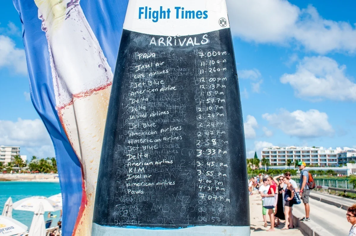 Schedule of planes landing written on a surfboard