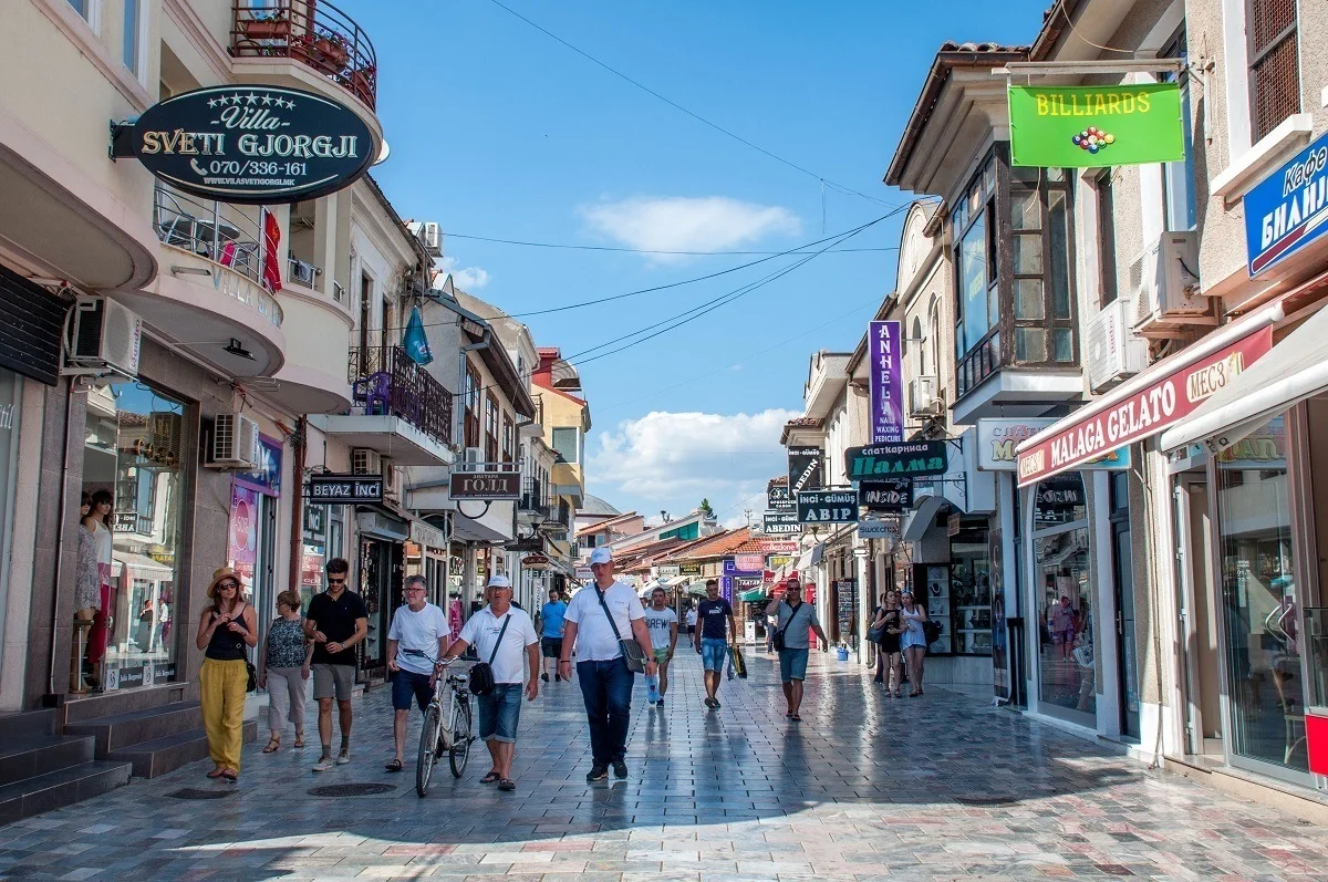 People walking down a street full of shops in Old Town Ohrid