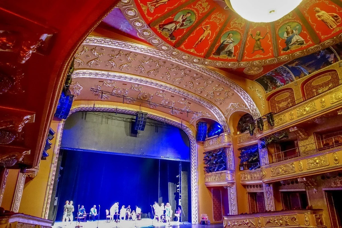 Performers on stage at a theater