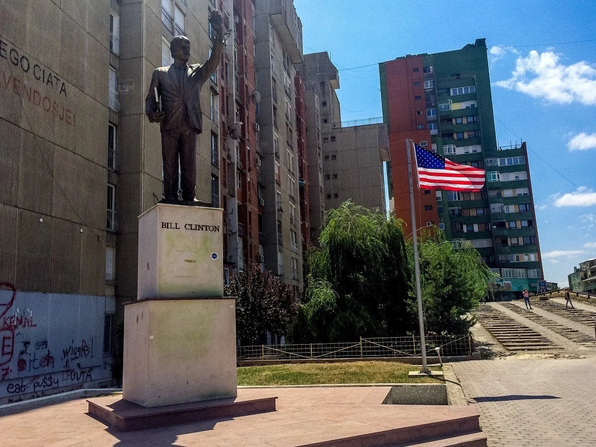 Bill Clinton statue and American flag in Pristina, Kosovo