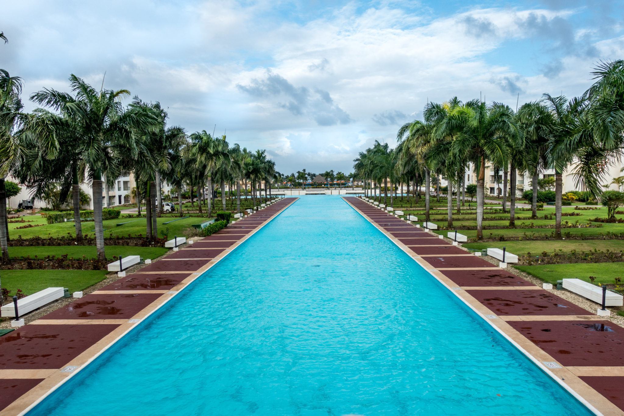 Pool lined with palm trees in Punta Cana Dominican Republic