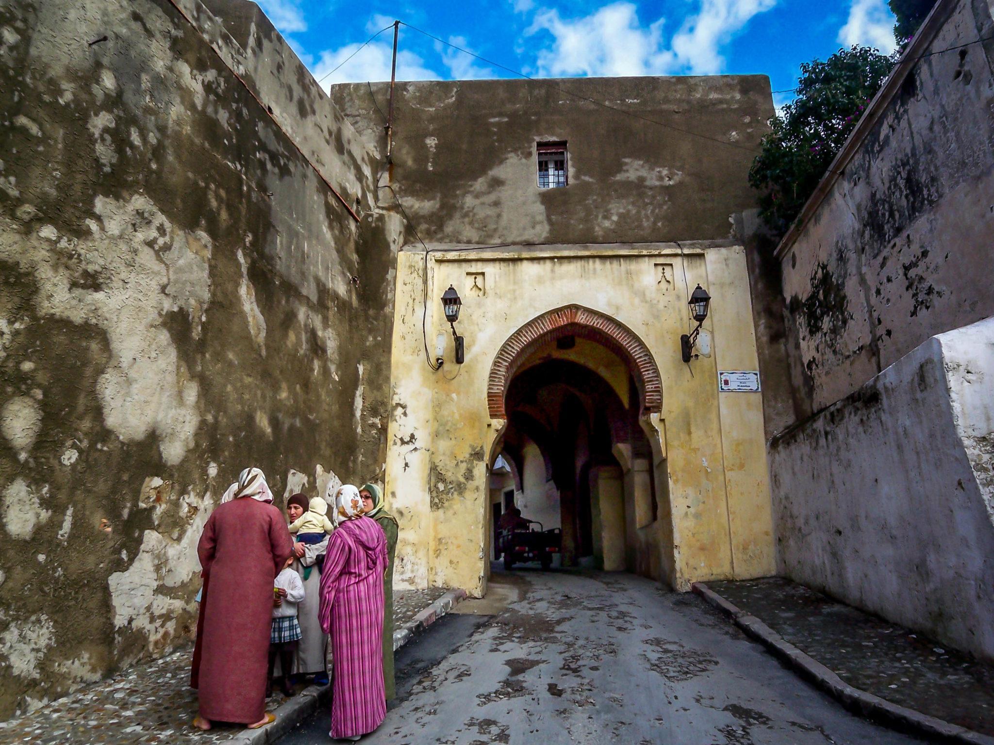 Woman and children by gate in Tangier, Morocco