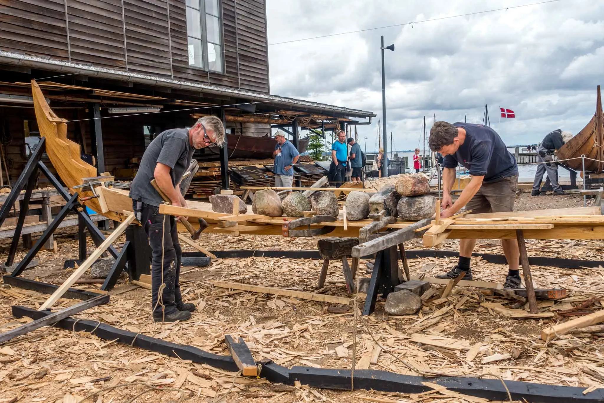 Expert builders building replica viking ships at the Viking Ship Museum in Roskilde, Denmark