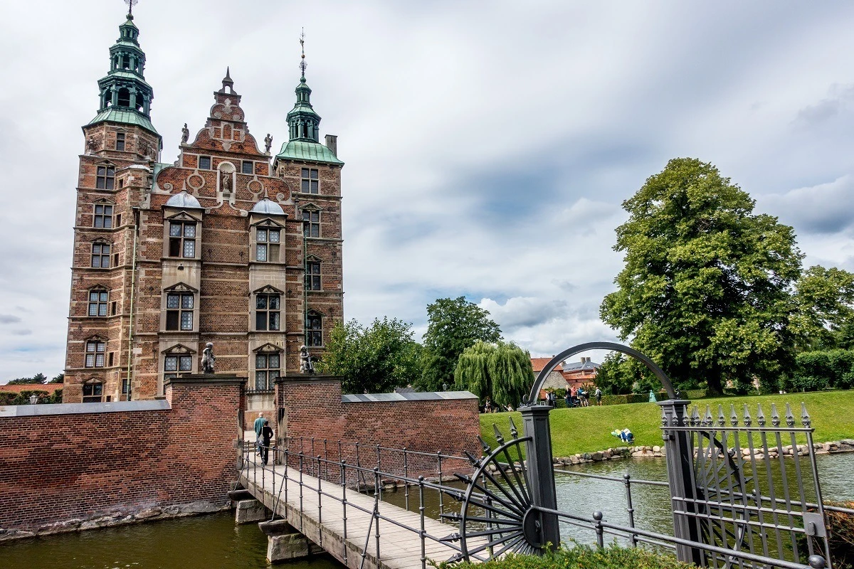 Rosenborg Castle with turrets and bridge across a canal in Copenhagen Denmark