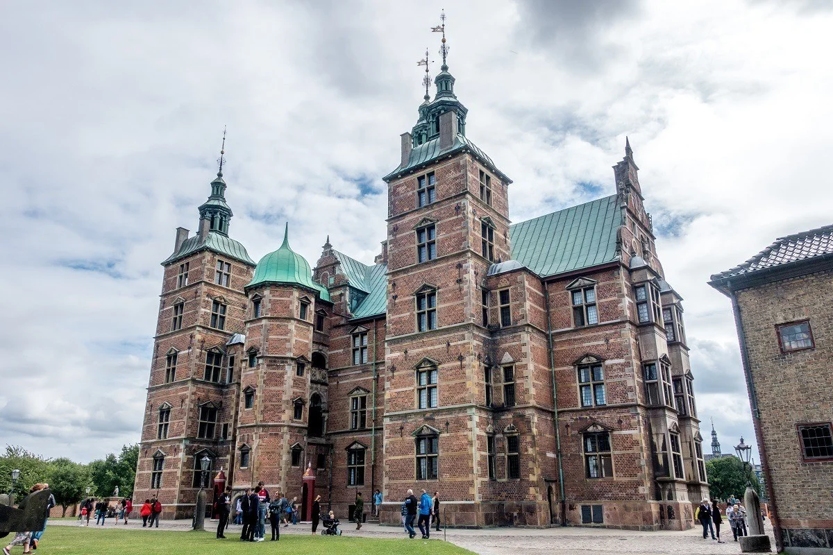 Large brick building with spires 