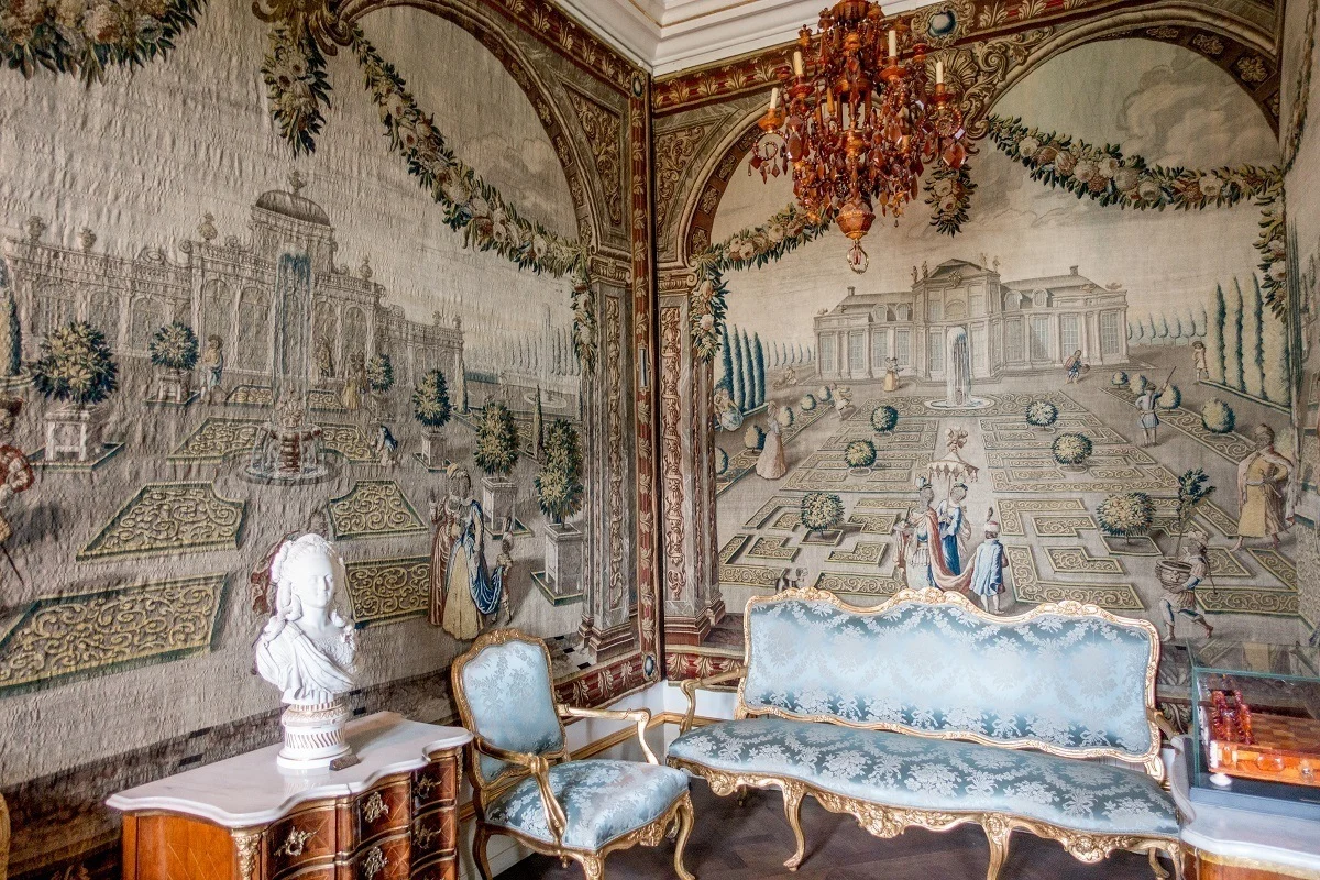 Room with tapestries and brocade furniture