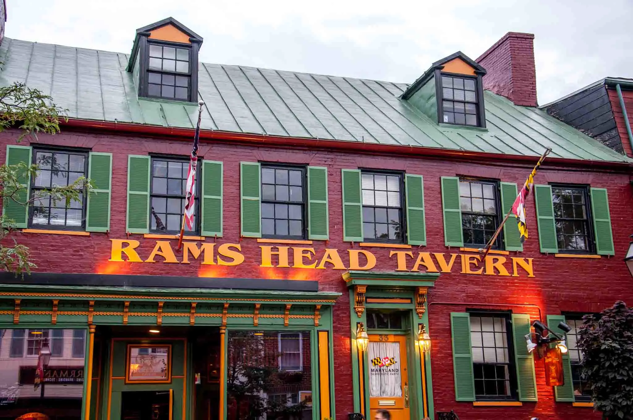 Painted red brick exterior of Rams Head Tavern