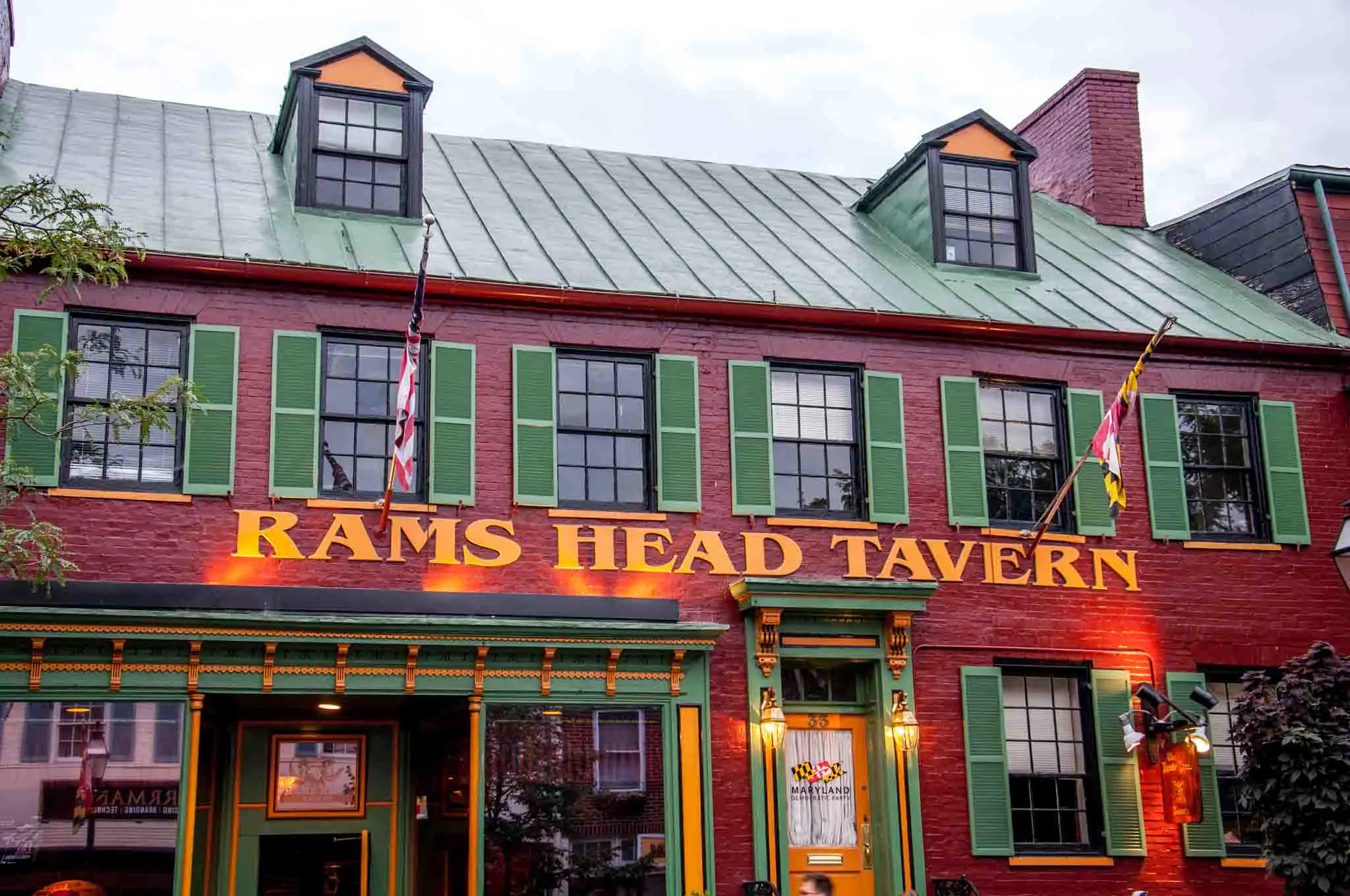 Painted red brick exterior of Rams Head Tavern.