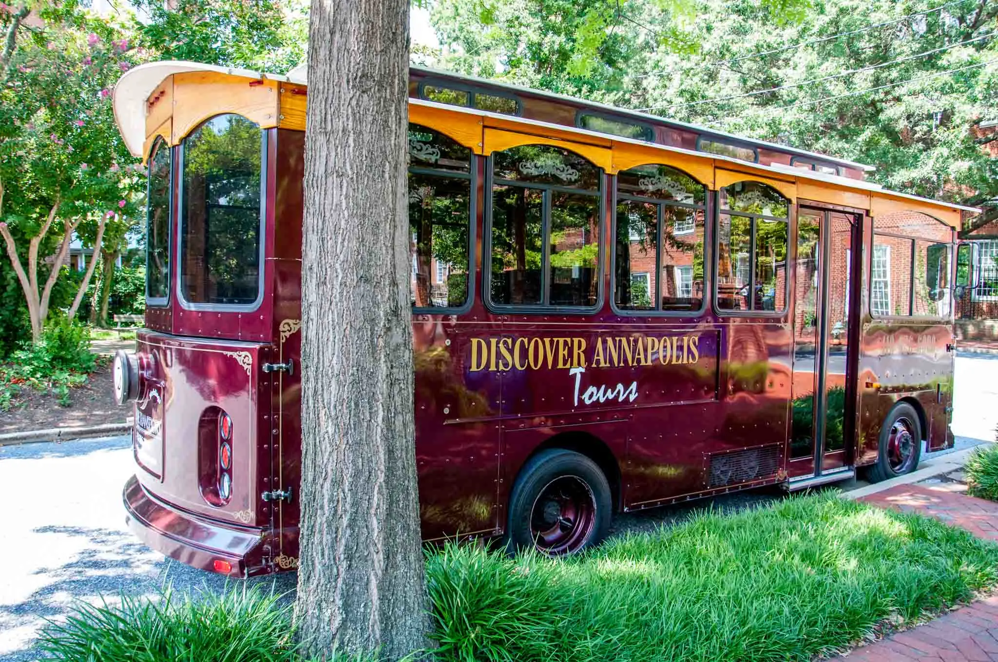 Red trolley car with "Discover Annapolis Tours" written on the side.
