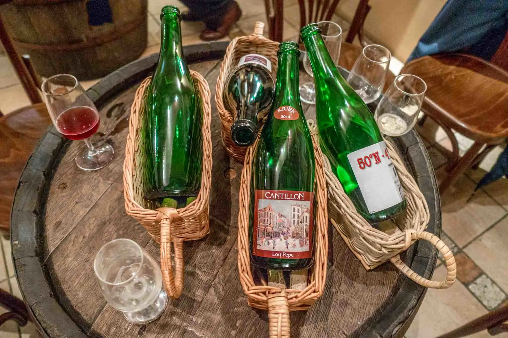 Beer bottles and glasses at Cantillon Brewery. 