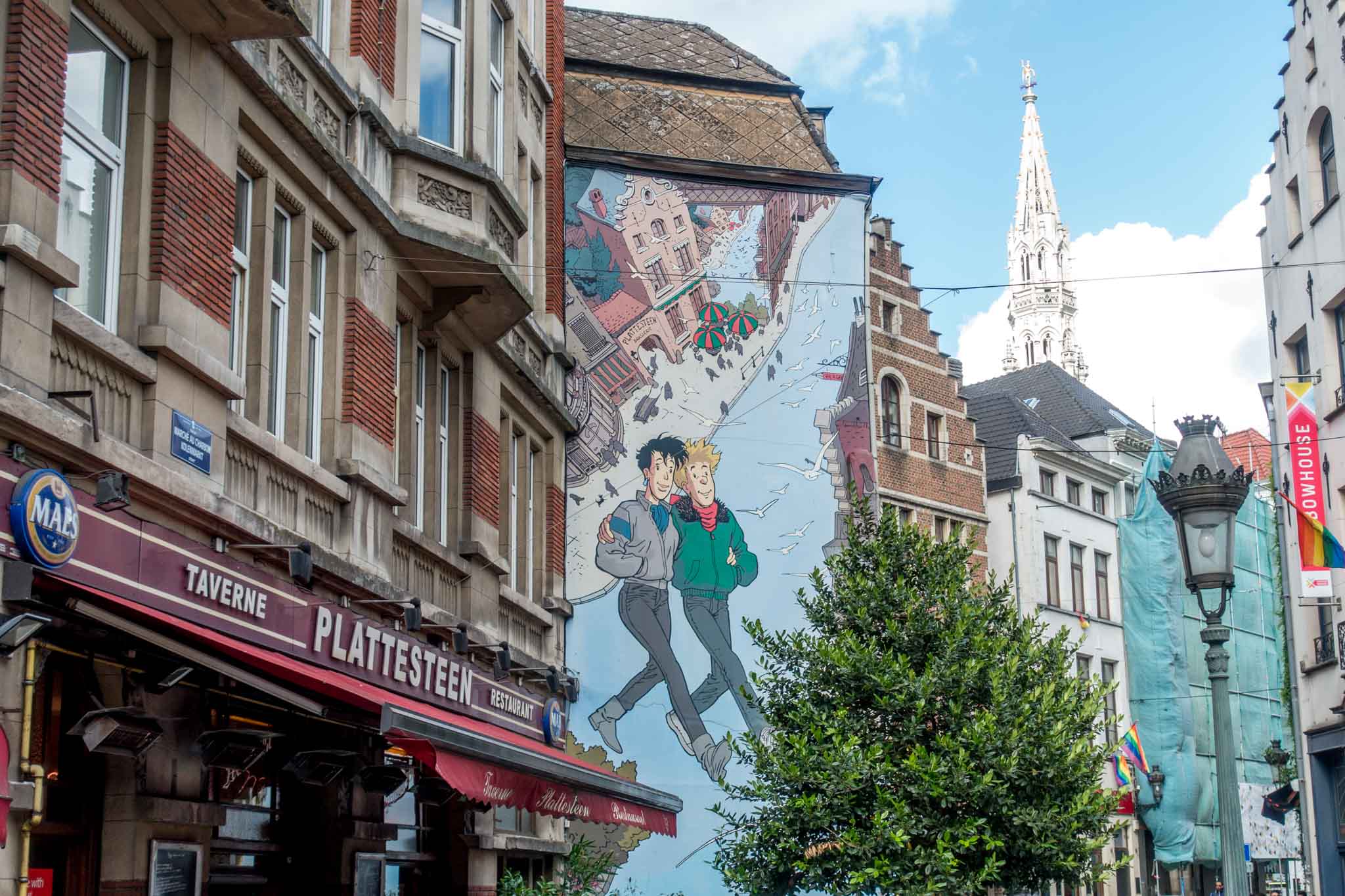 Street art mural of couple walking down the street in Brussels