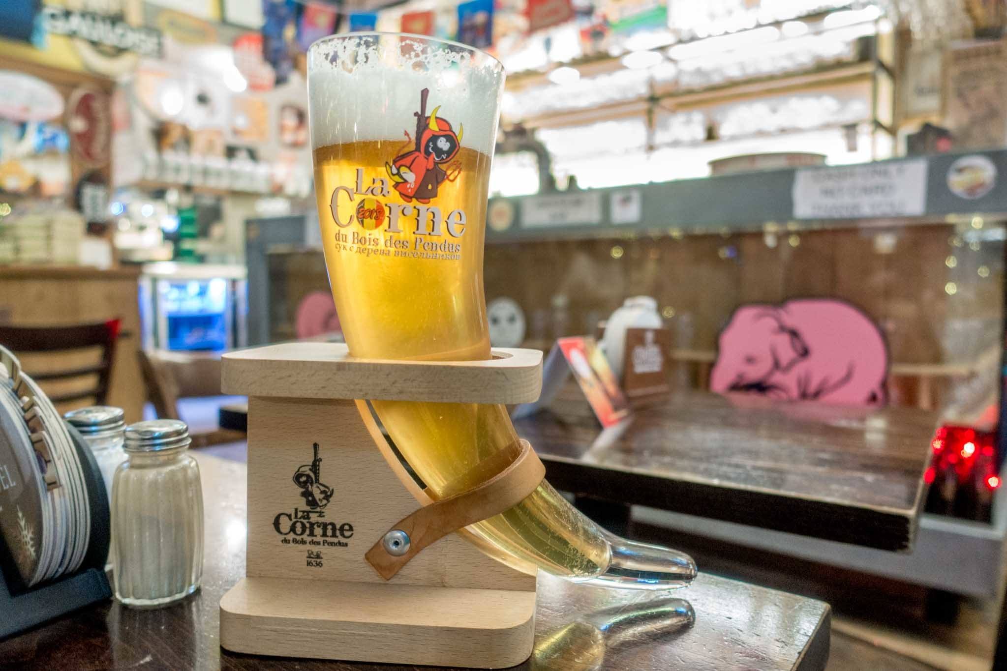 Horn-shaped glass full of beer.