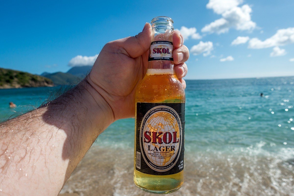 Bottle of Skol Lager from St. Kitts at the beach