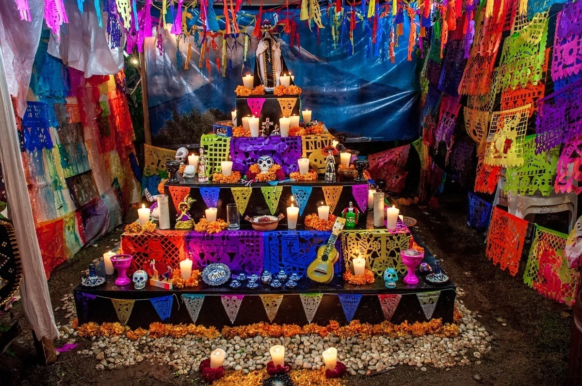 Colorful altar with candles and memorial items