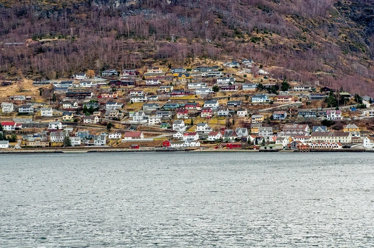 Buildings on a hillside near the water.