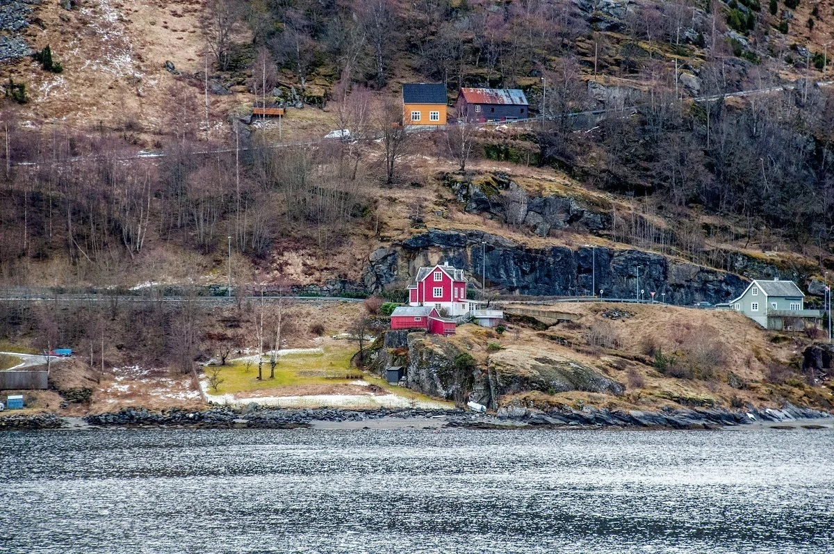 Colorful houses dot the sides of a fjord in Norway