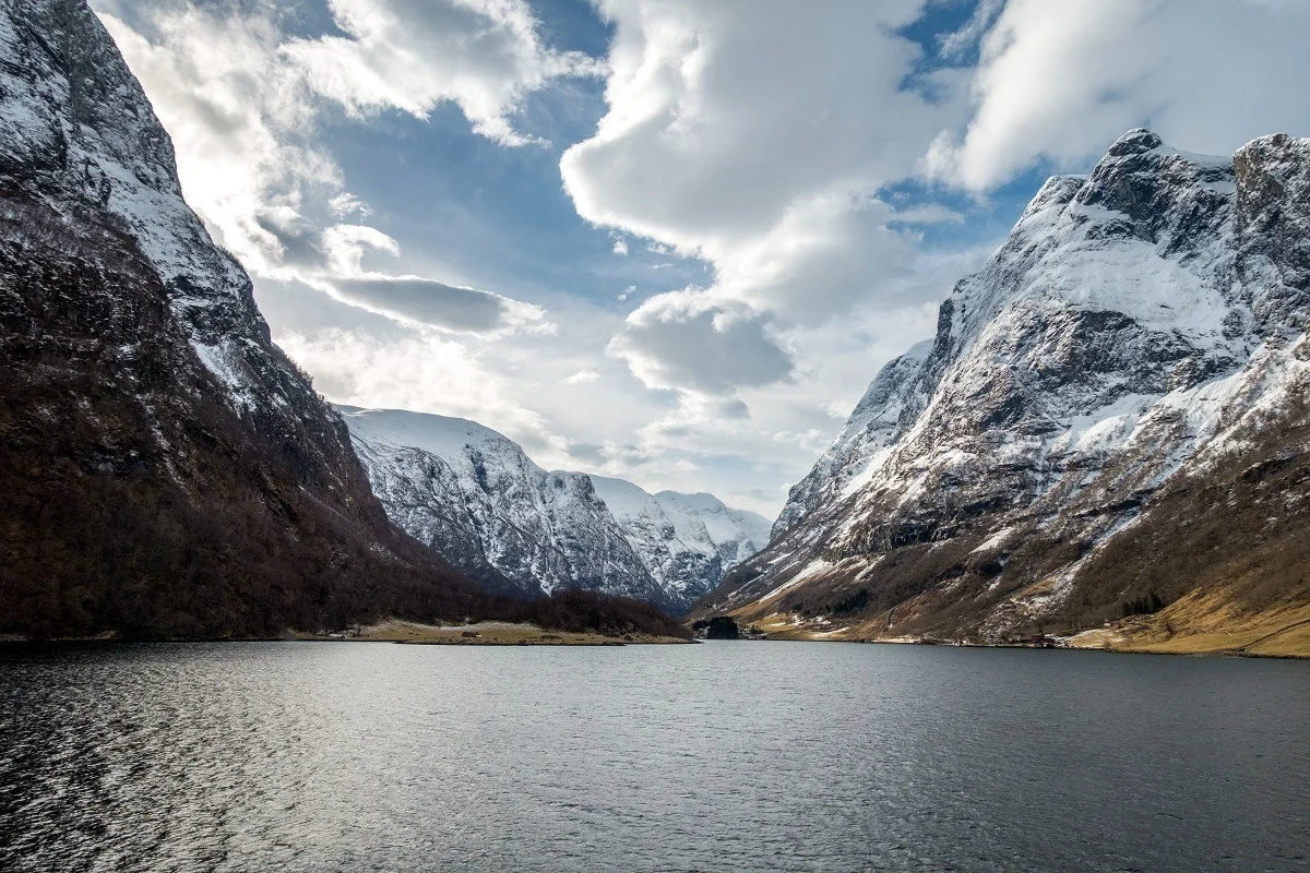 Water and snowy mountains of a fjord.