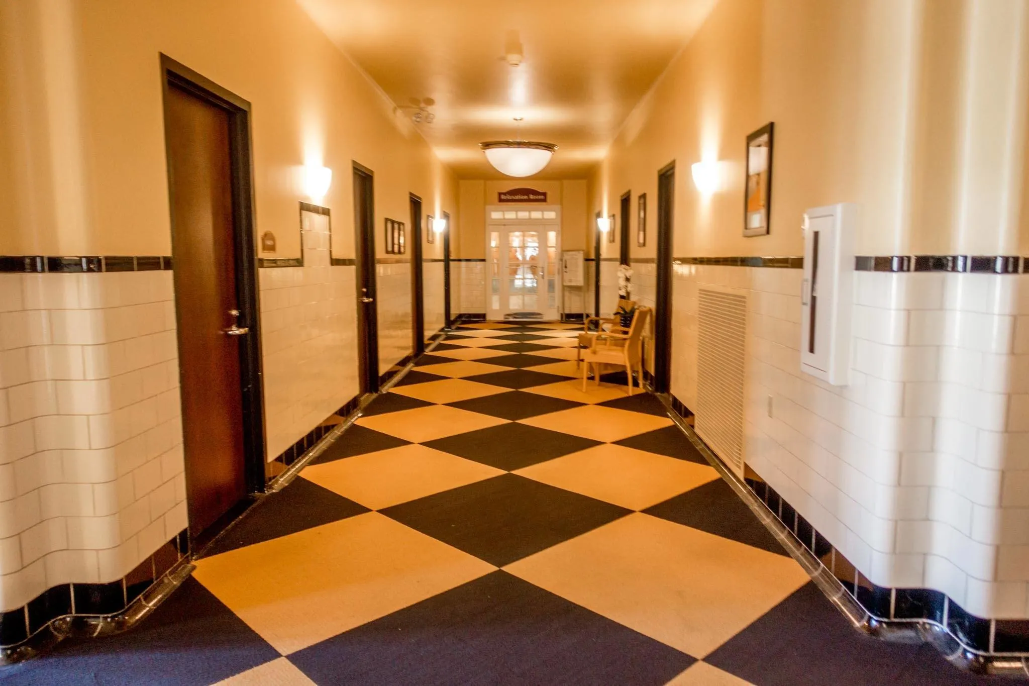 Black and white tiled hallway. 