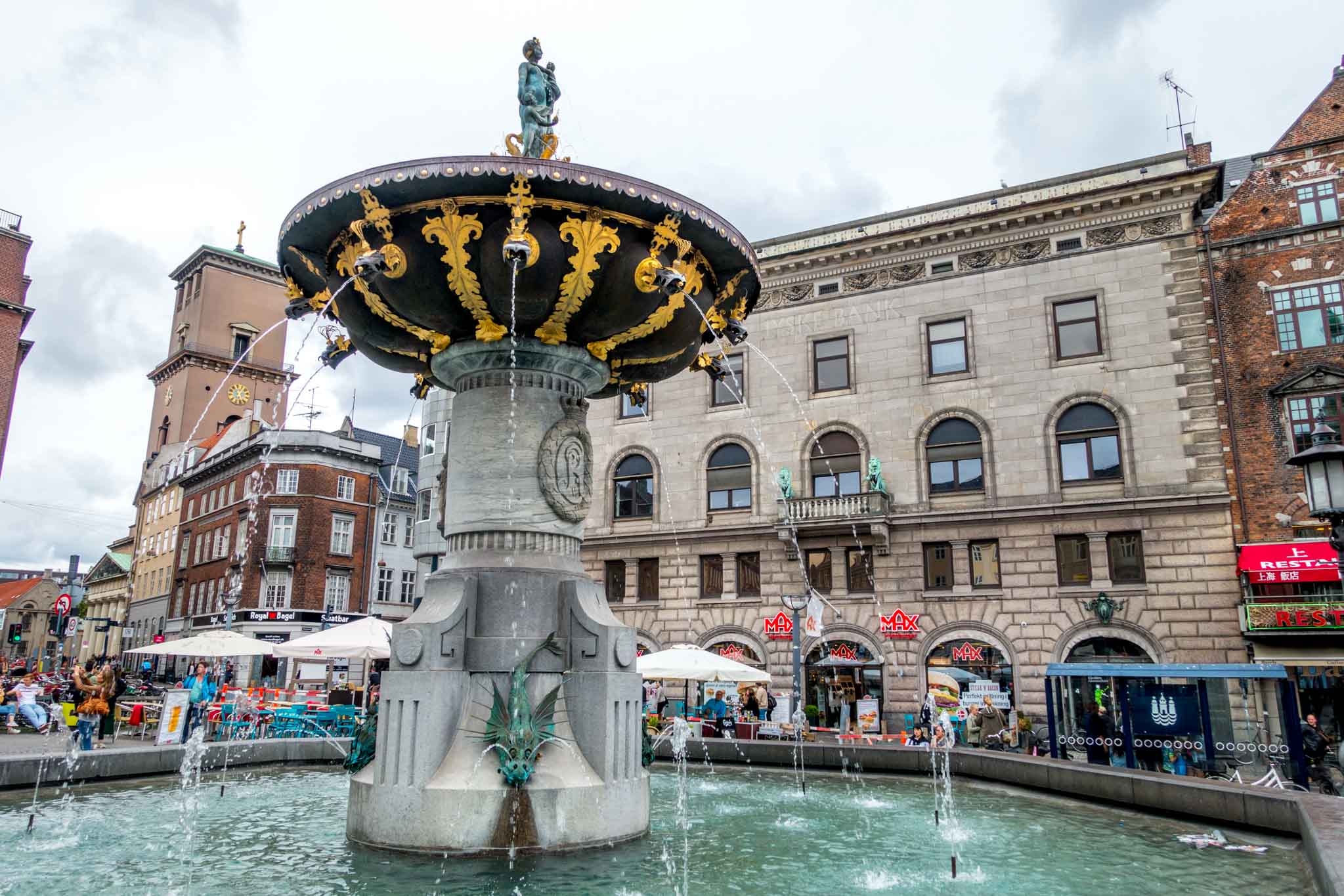 Fountain and stores on a pedestrian shopping street