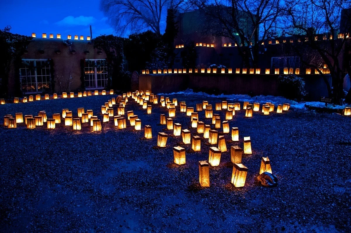 Illuminated lanterns in a cross pattern is a hallmark of this Santa Fe tradition