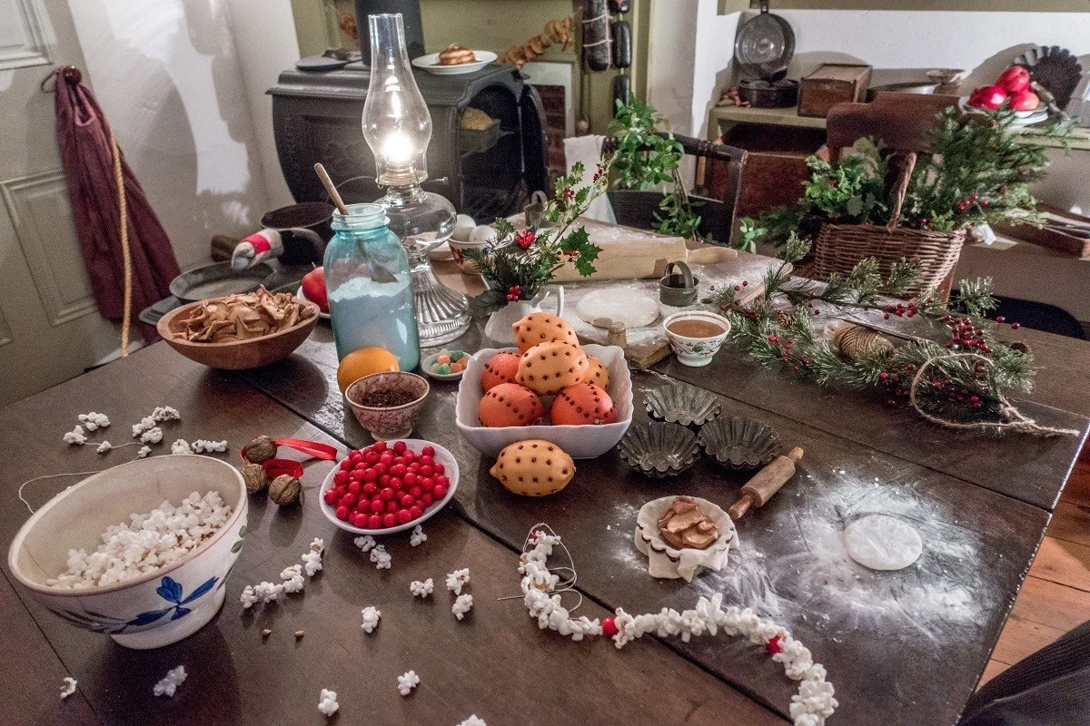 Old-fashioned Christmas decorations and holly on a table 