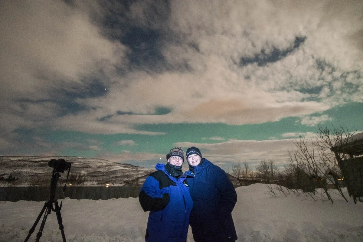 Use a short burst from a flashlight to take a northern lights selfie.
