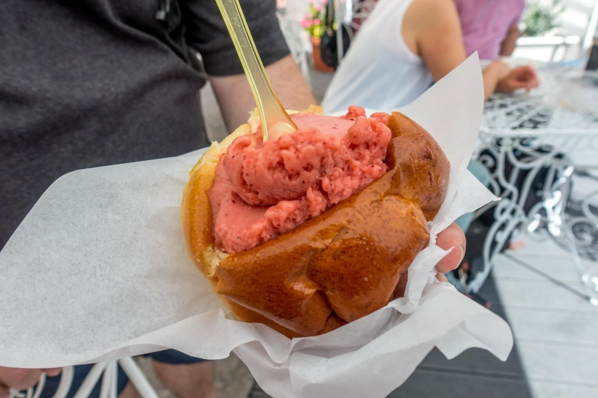 Strawberry gelato stuffed inside a brioche roll