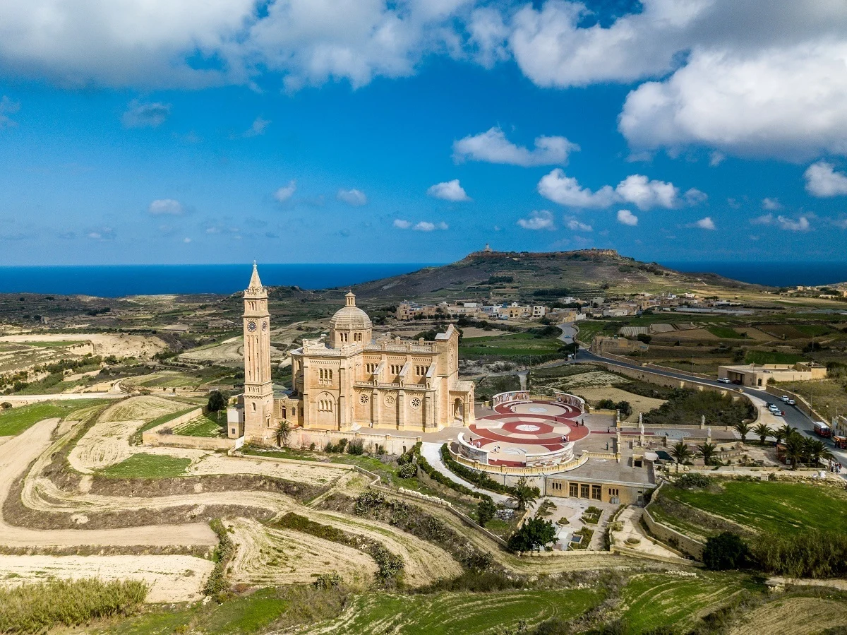 Overhead view of church with grassy landscape 