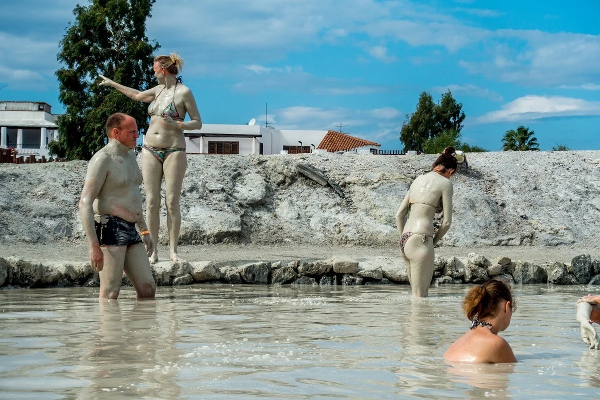 People coating their bodies in mud and silt