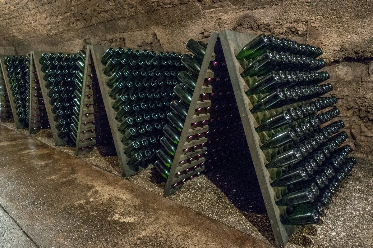 Wine aging in bottles in wine cellar