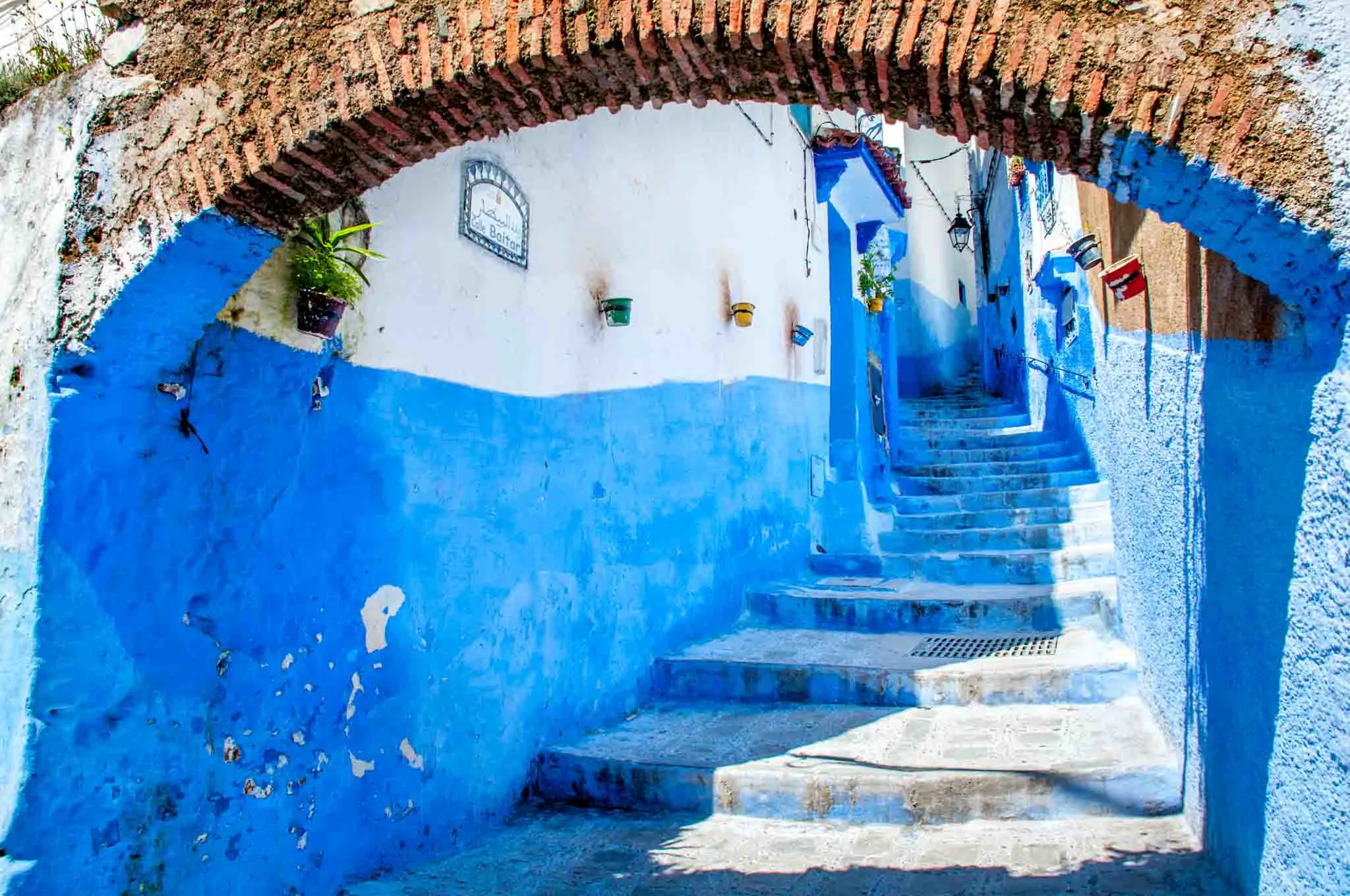 Blue walls line a blue stairway