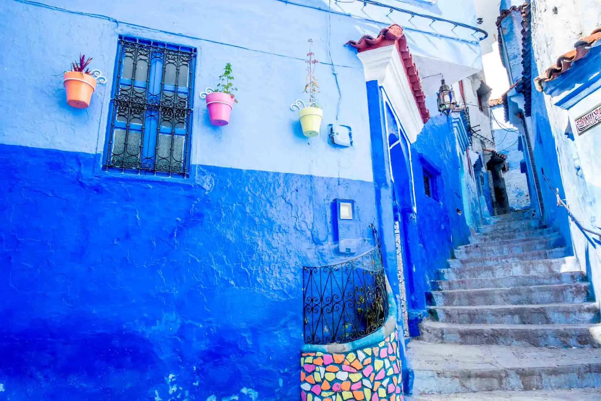 Staircase between two blue walls.