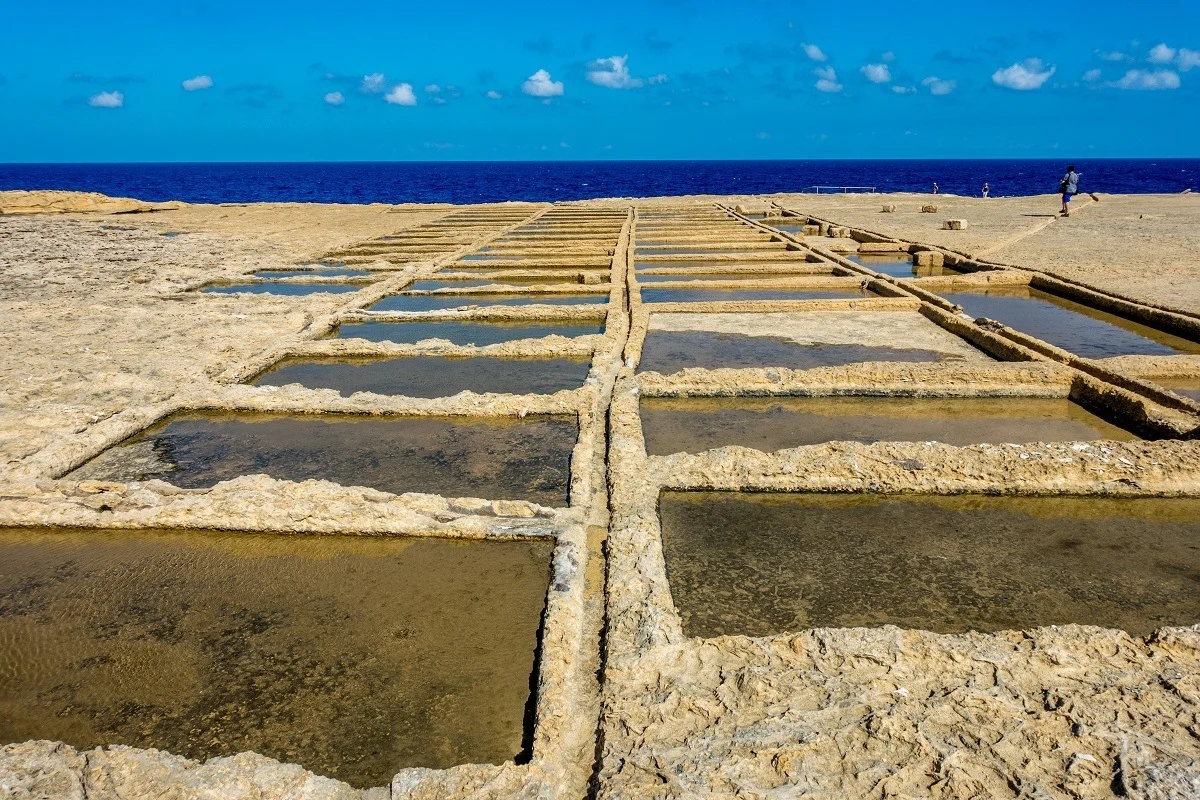 Open air salt pans by the ocean in Gozo