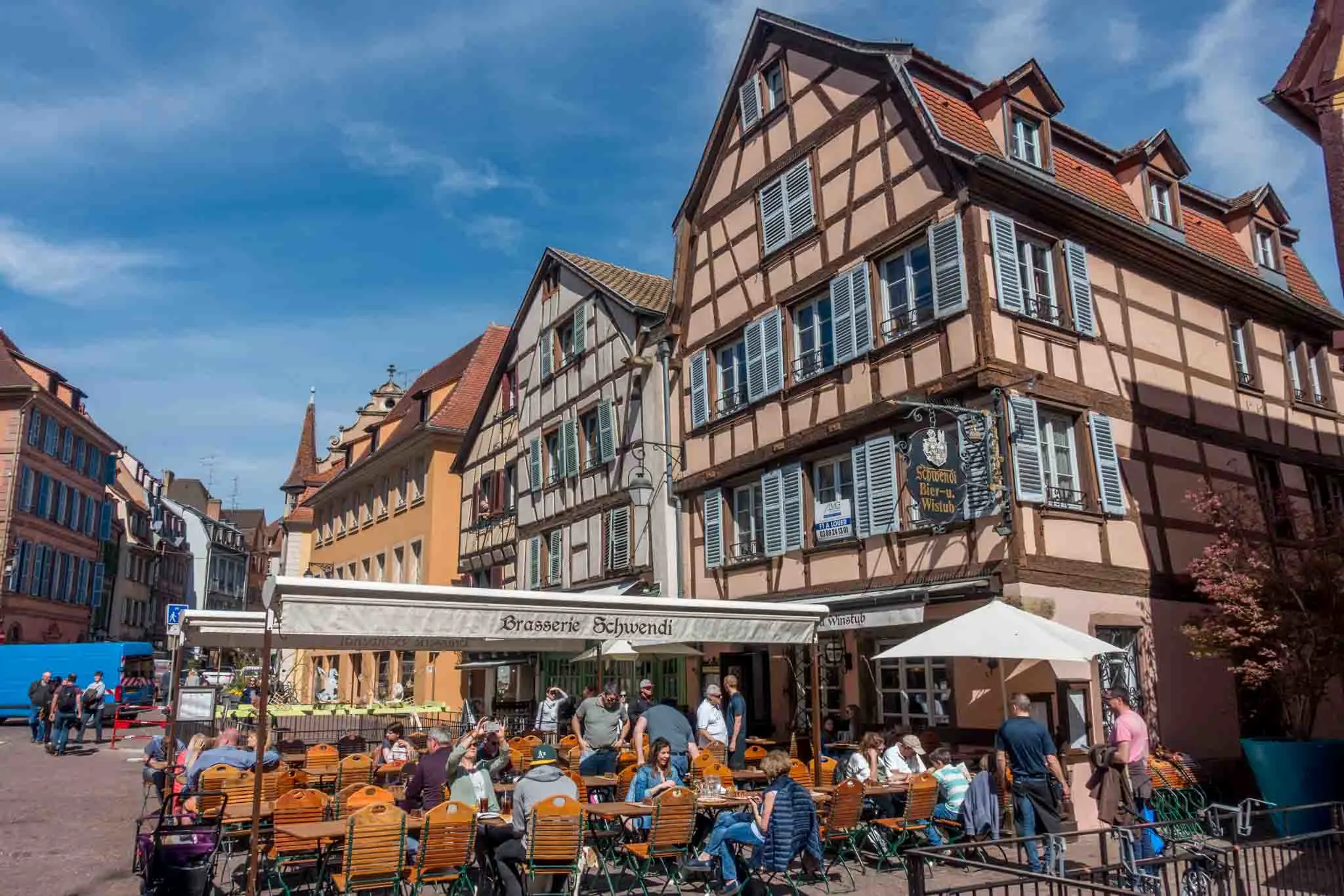 People eating at outdoor cafes