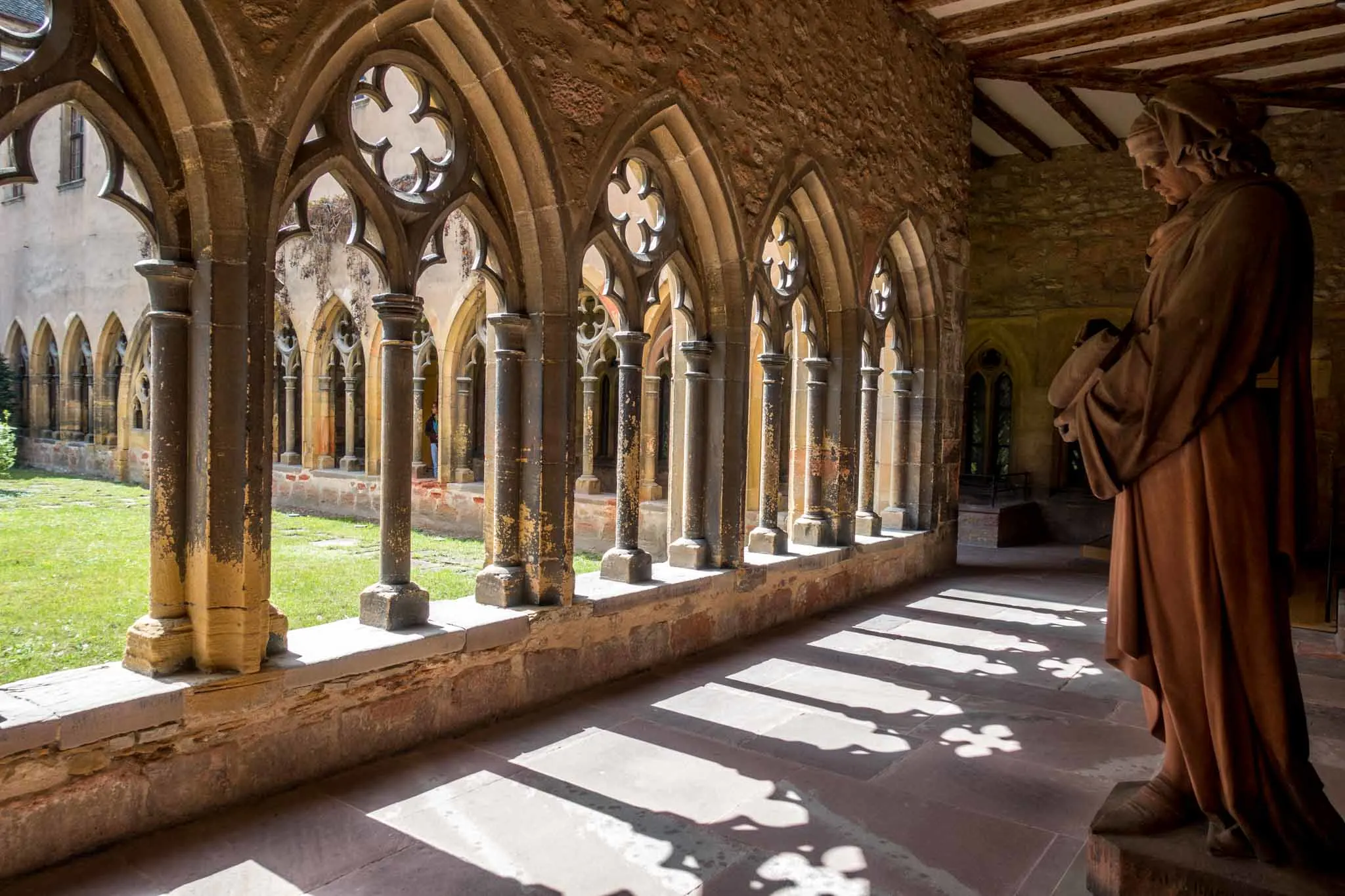 Religious statue near the courtyard of a medieval cloister