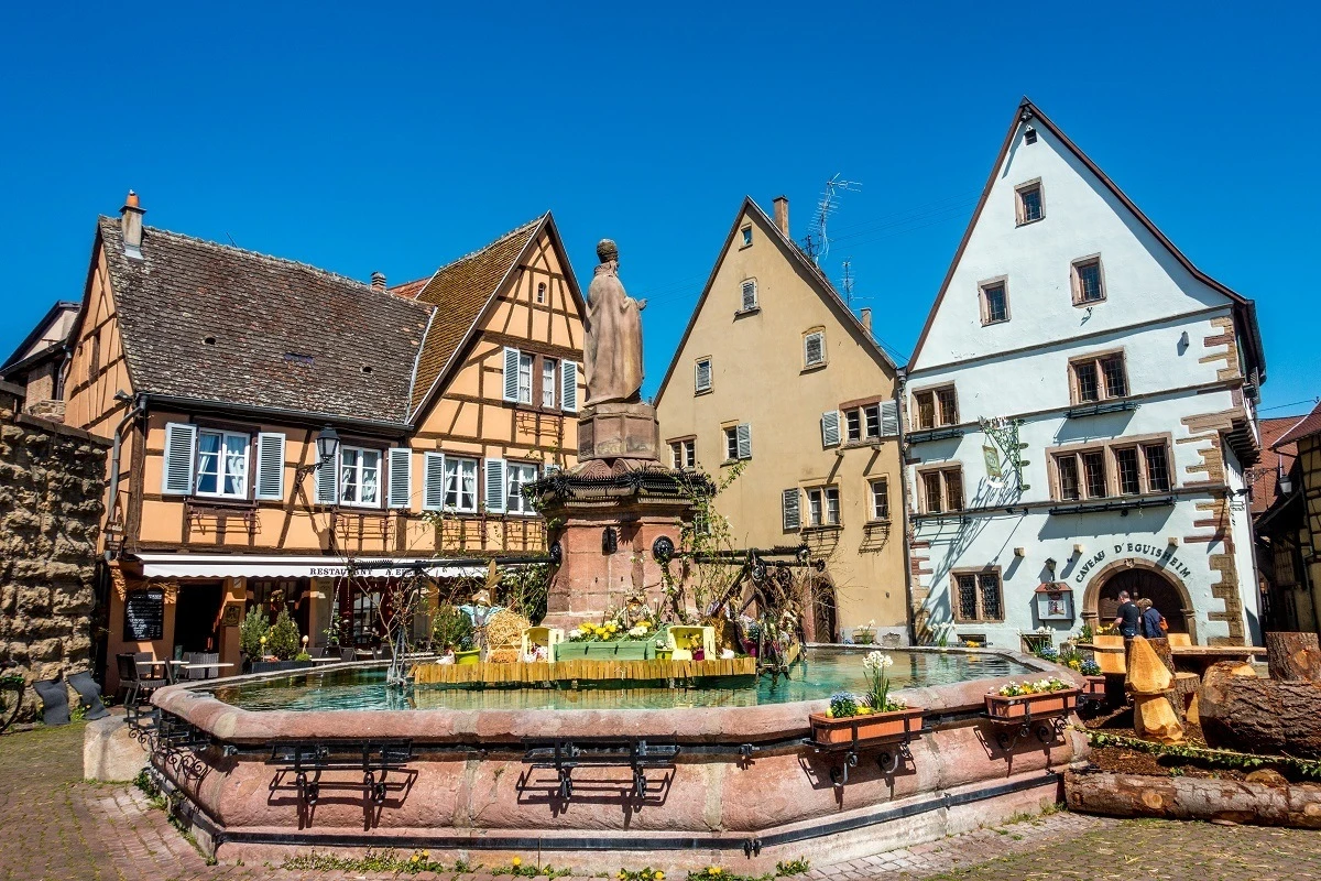 Fountain and buildings in a town square 