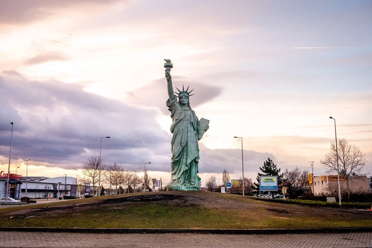 Replica of the Statue of Liberty in a roundabout. 