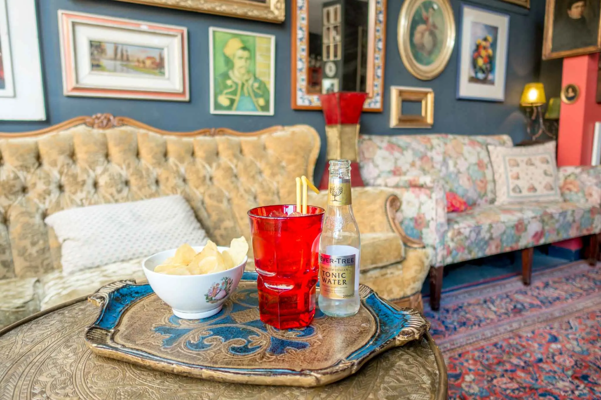 Cocktail and snacks in cafe with vintage furniture.