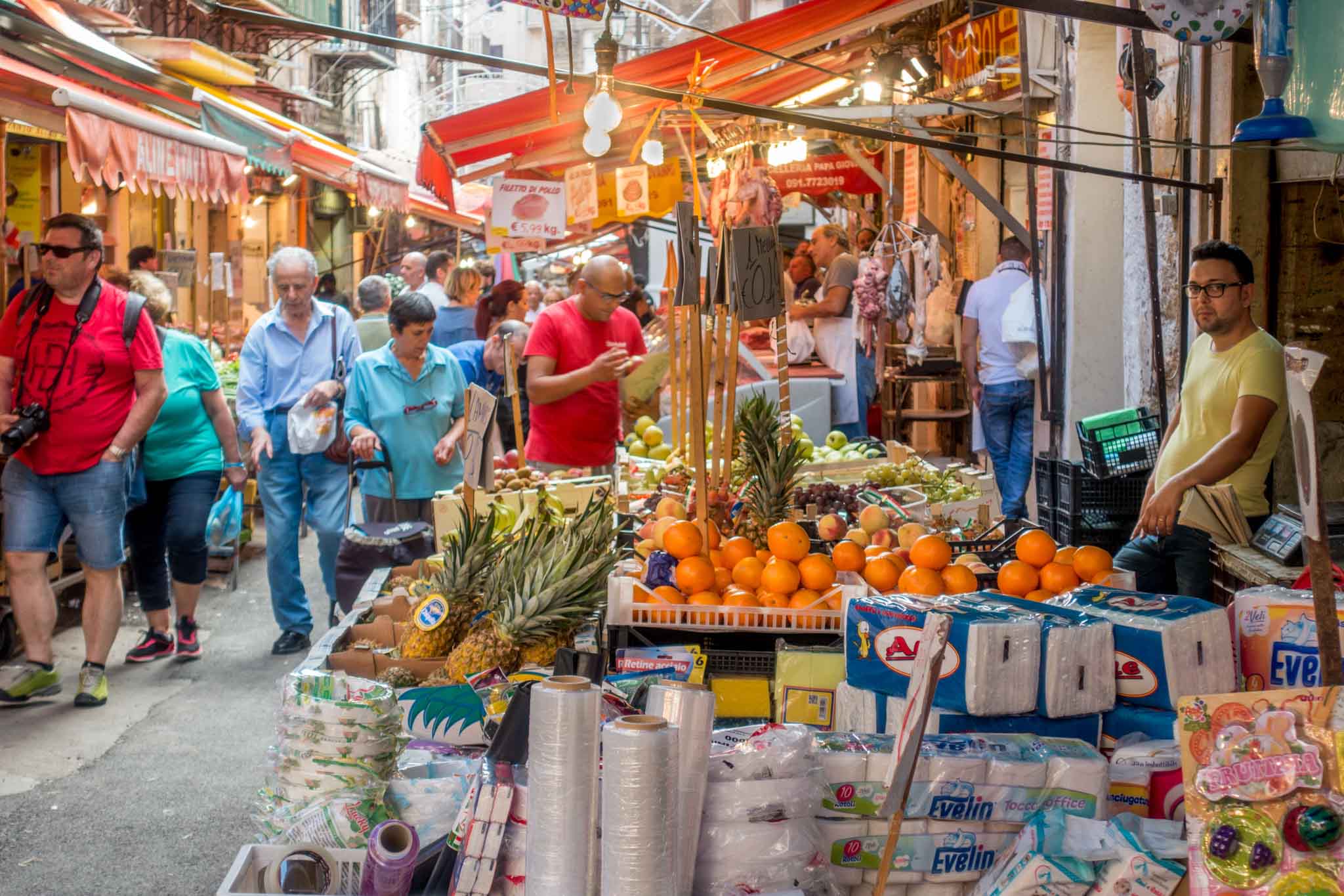 Shoppers at an outdoor food market