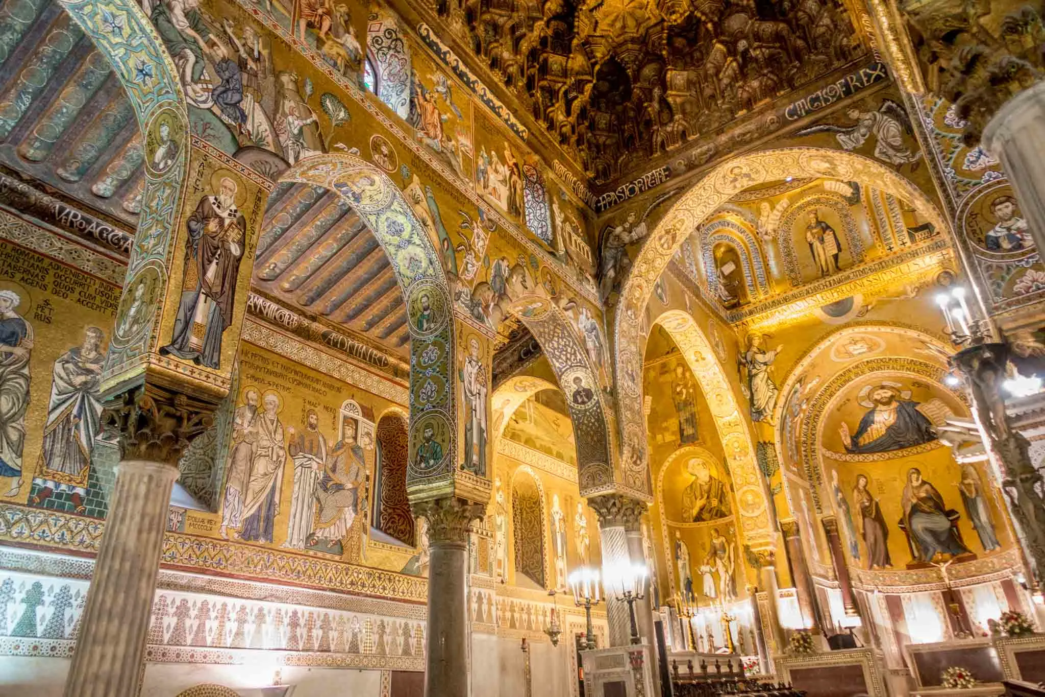 Interior of chapel covered in gold and tiled mosaics