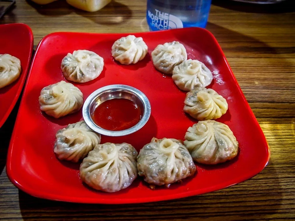 A plate full of momo dumplings at a Nepal tea house