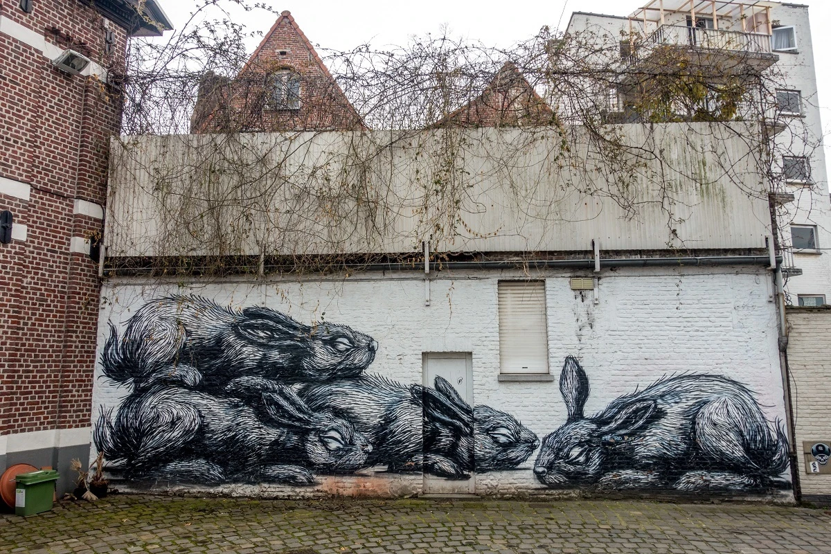 Street art mural with four rabbits.