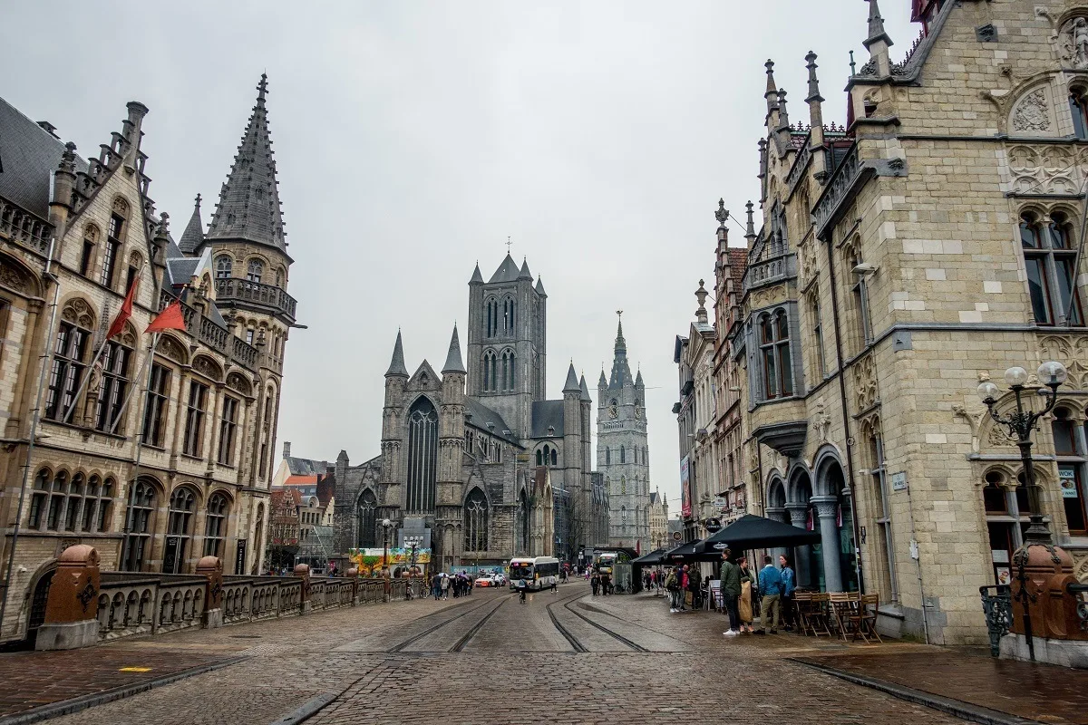 Churches and bell towers along a street.