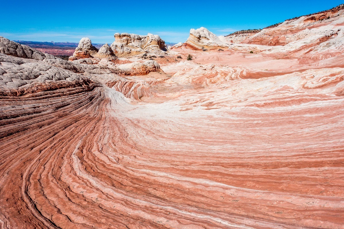 The colorful, wavy rock formations of White Pocket Arizona in the Vermilion Cliffs National Monument.